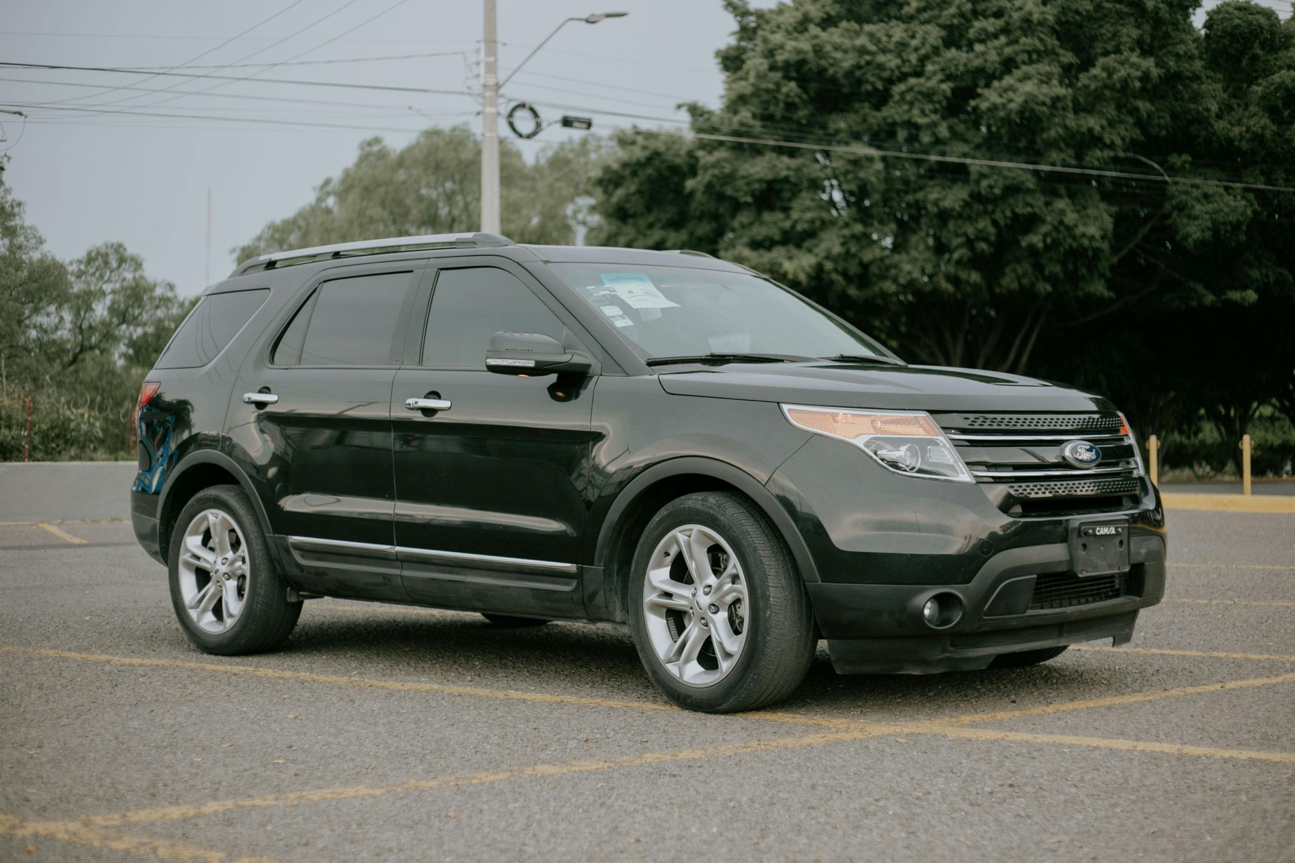 Photograph of a Black Car on a Road